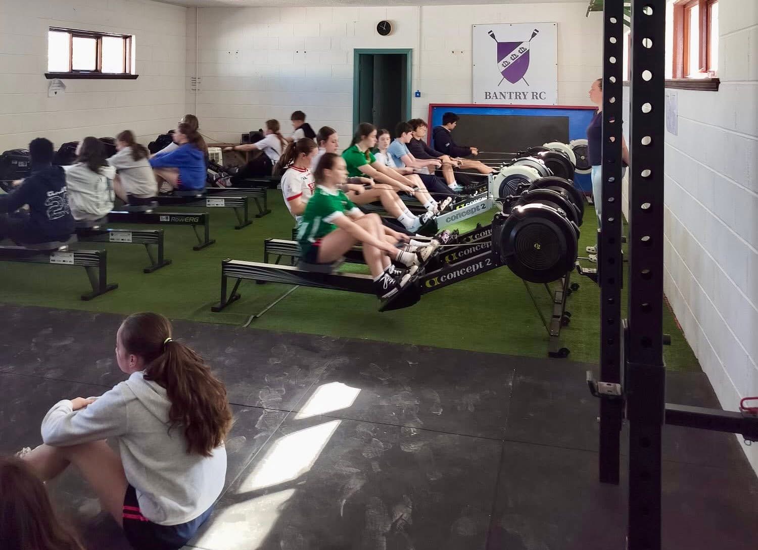 Pupils using indoor rowing machines at Bantry Rowing Club