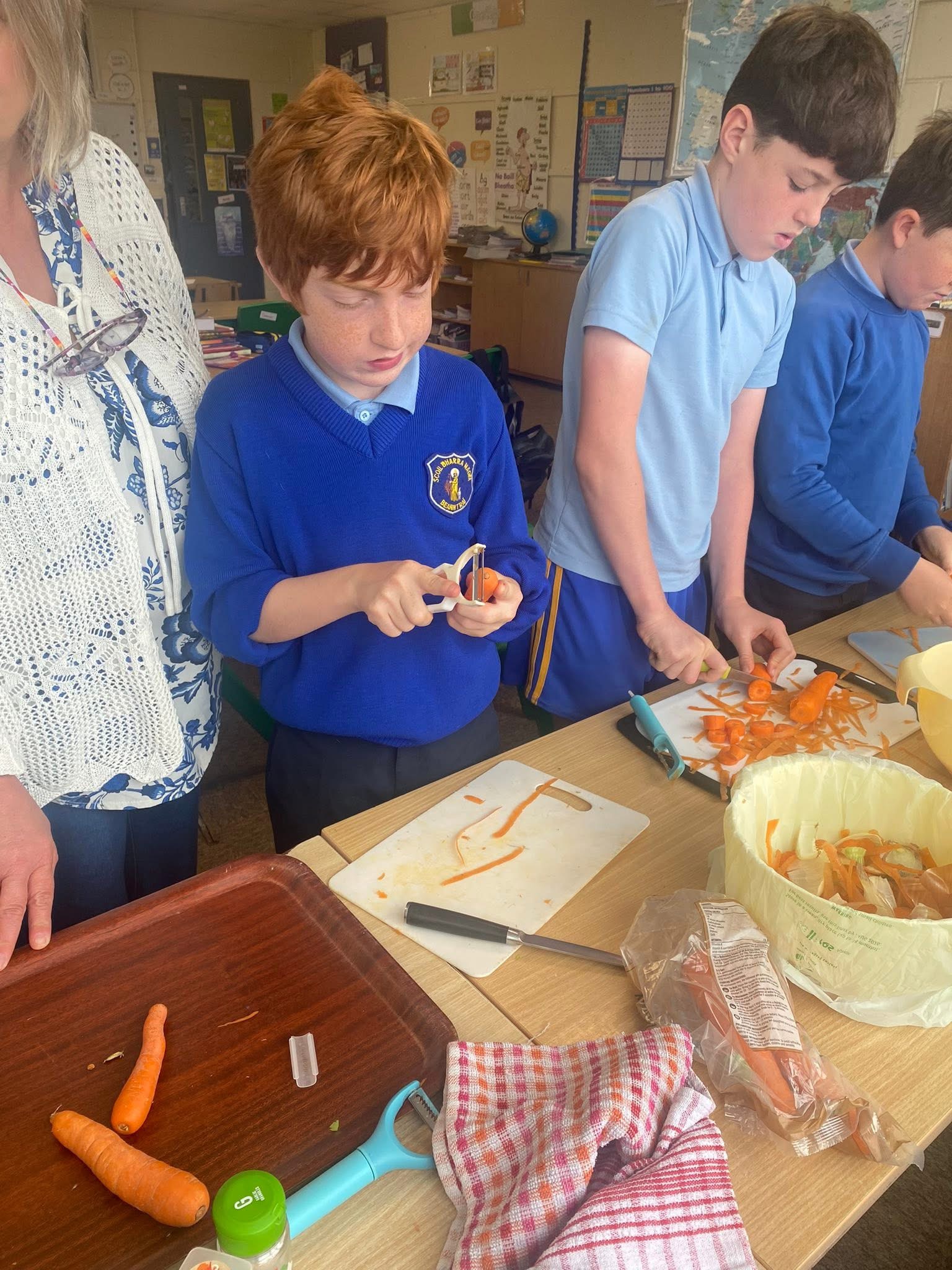 Pupils preparing vegetables during a cooking activity