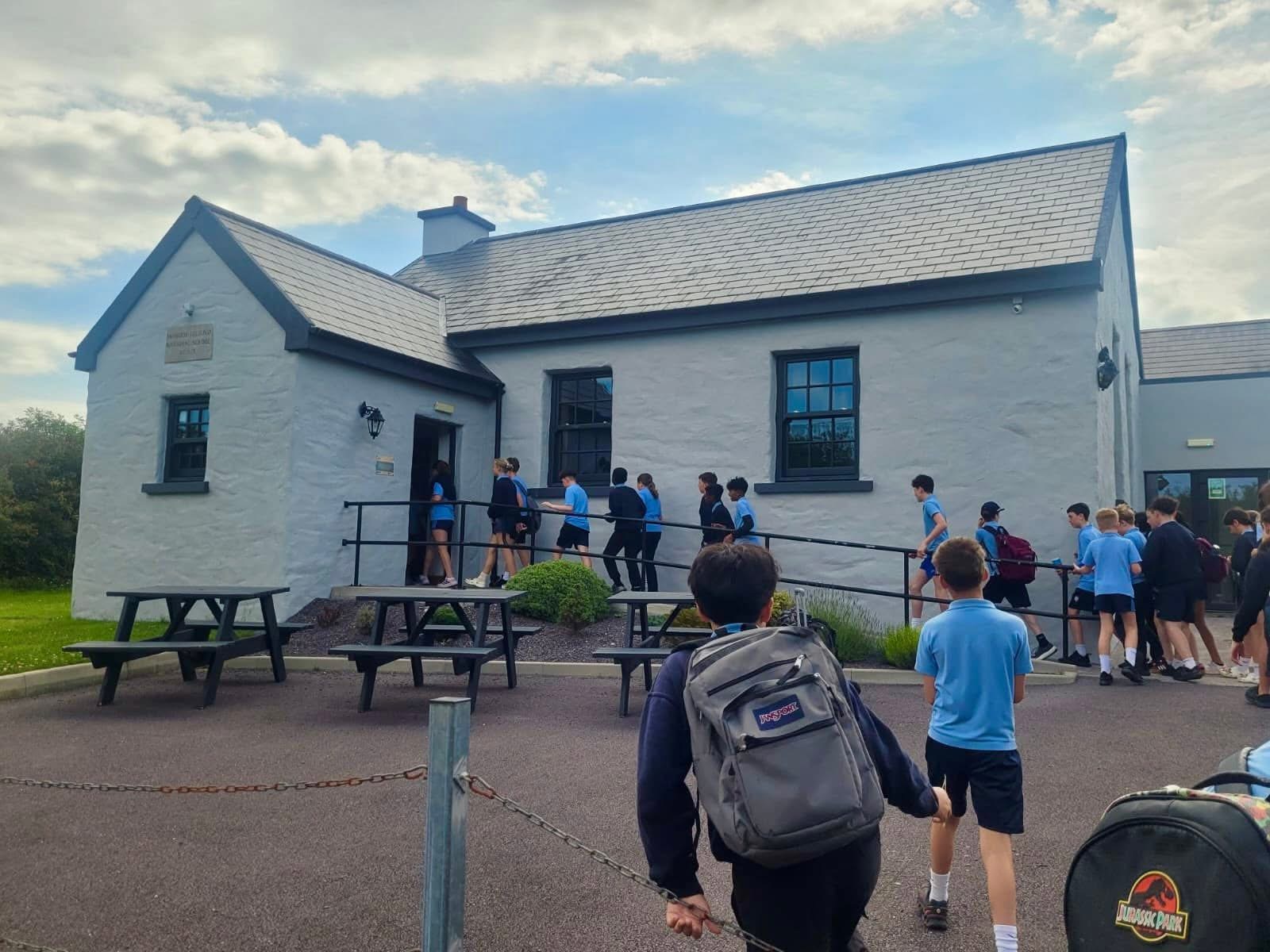 Pupils arriving at a historic building during a school history trip