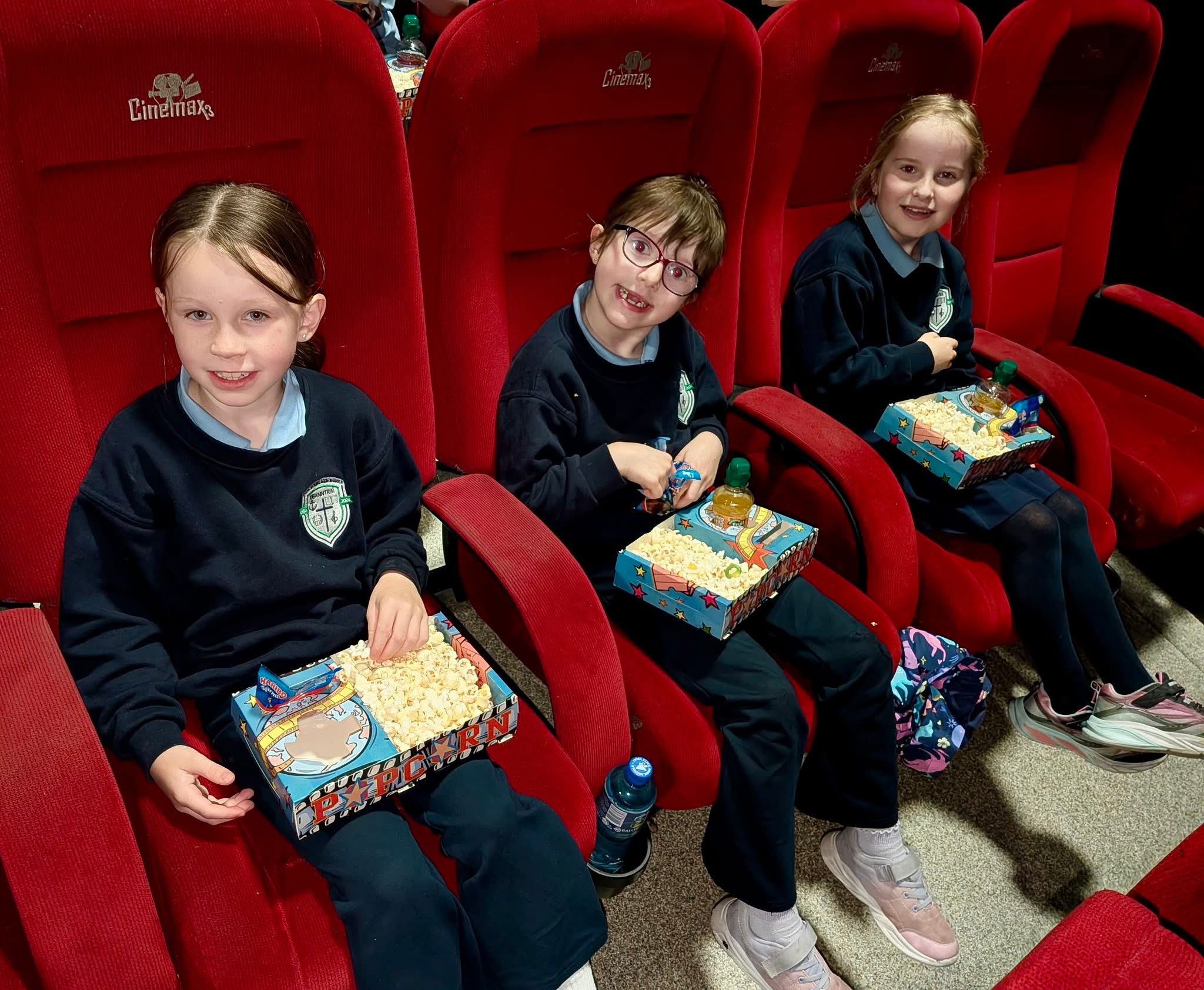 Pupils enjoying a school cinema trip