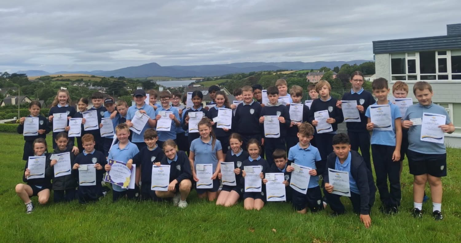 Pupils holding certificates for their Mini Company project