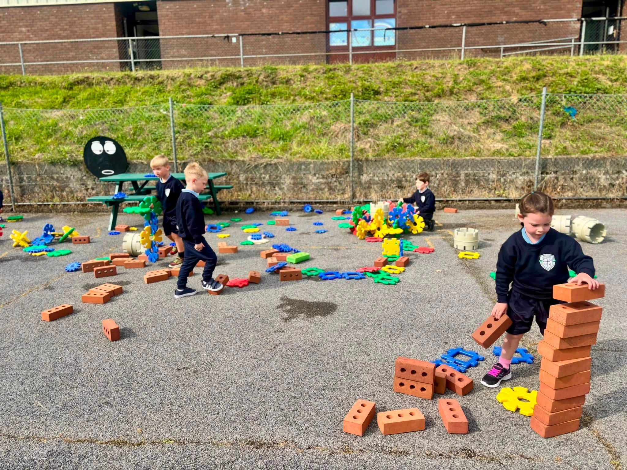 Junior Infants enjoying outdoor construction play