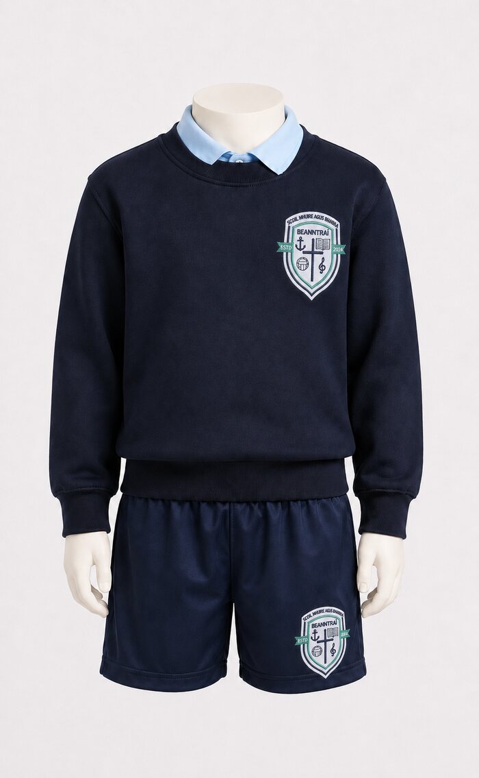 Crested jumper, light blue polo shirt and crested school shorts