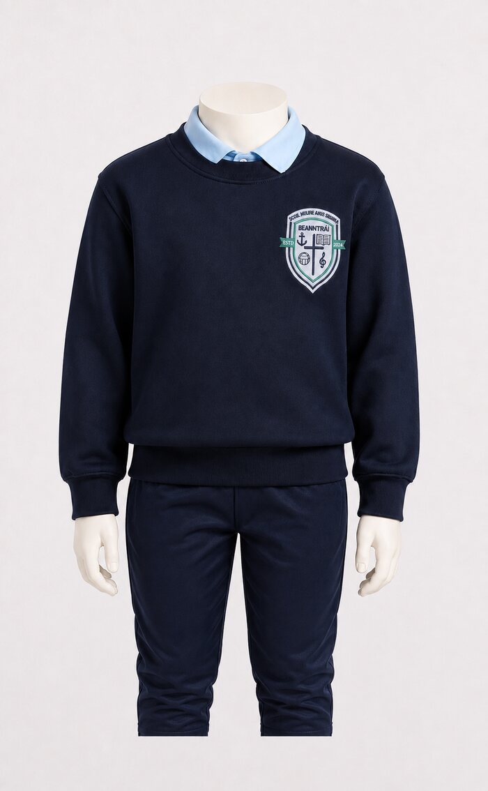 Crested jumper, light blue polo shirt and plain navy tracksuit bottoms