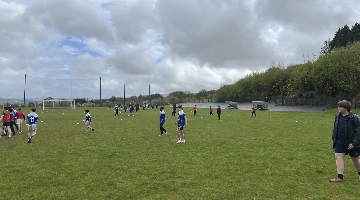 Pupils taking part in rugby on the playing field